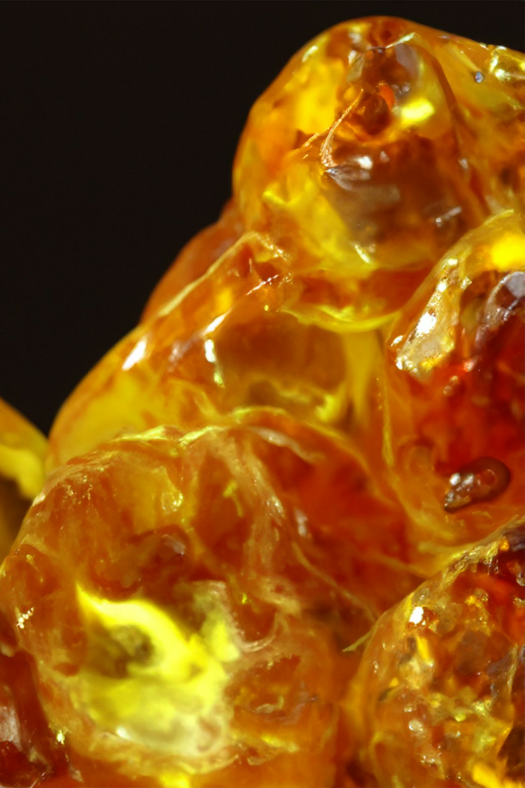 Close up of raw golden amber stones